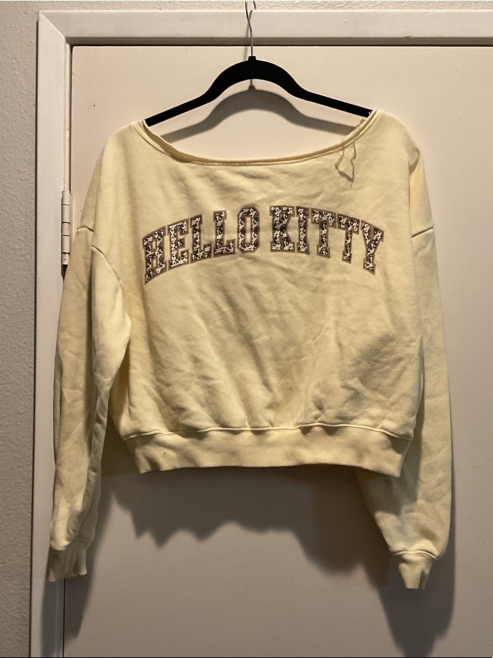 Hello Kitty Off-the-Shoulder Cropped Sweater in Pale Yellow